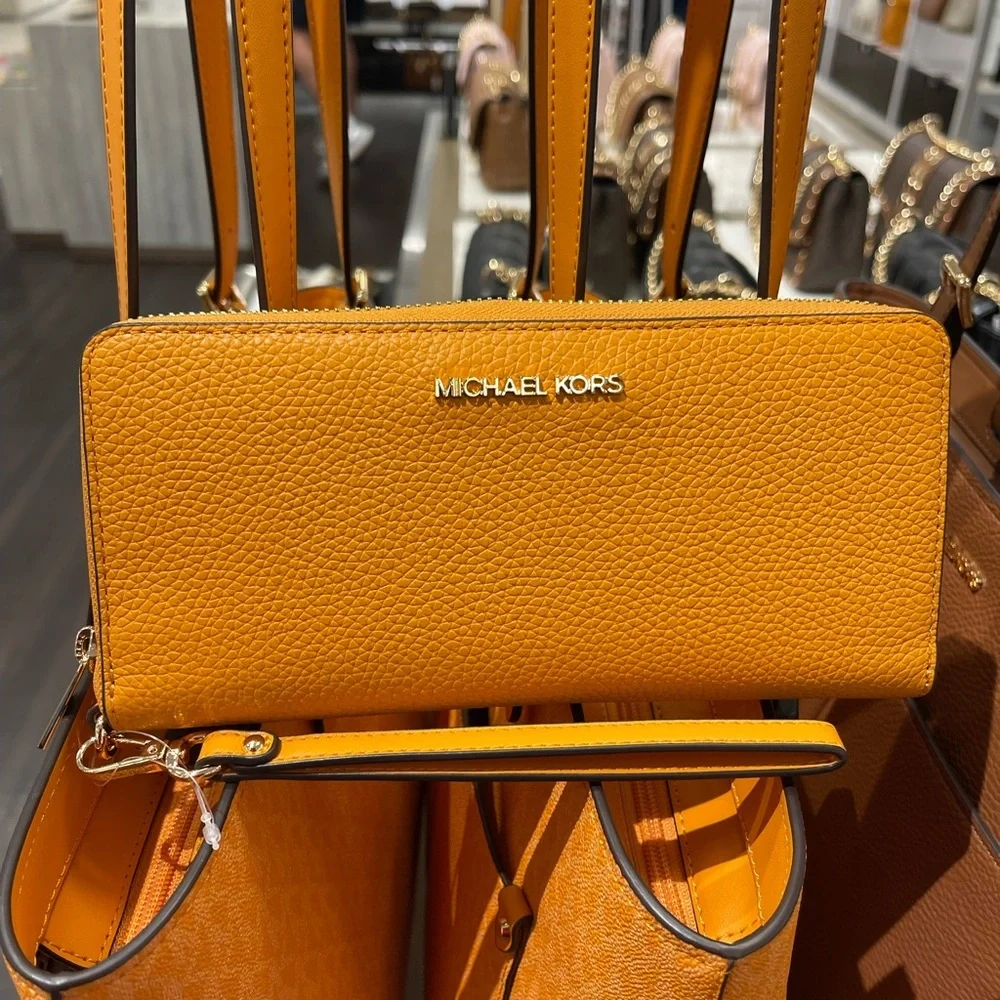 MICHAEL KORS Jet Set Travel Lg Pebbled Leather Continental Wristlet
Rad Orange - Picture 13 of 16